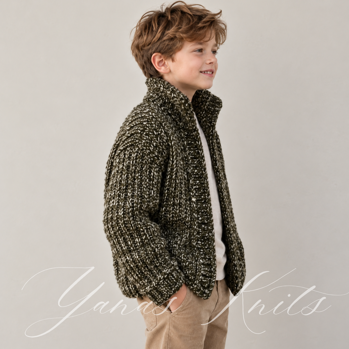 Side view showing the dropped shoulder and full sleeve of a chunky ribbed children's cardigan