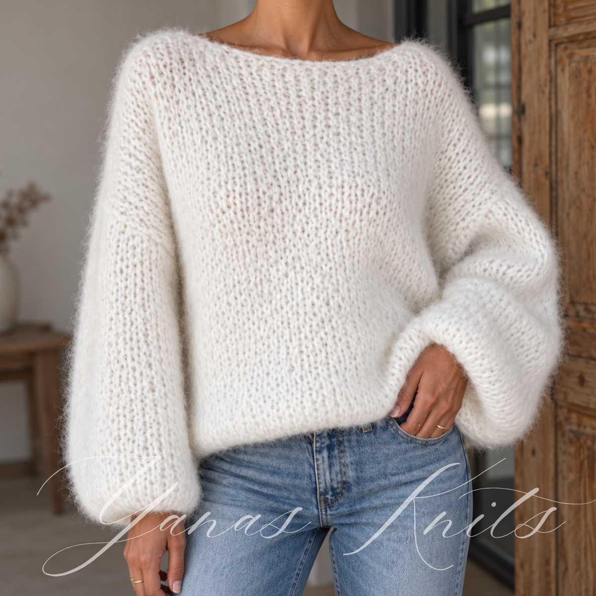 Front view of a fluffy ivory oversized sweater with a wide boat neckline and relaxed drop shoulders